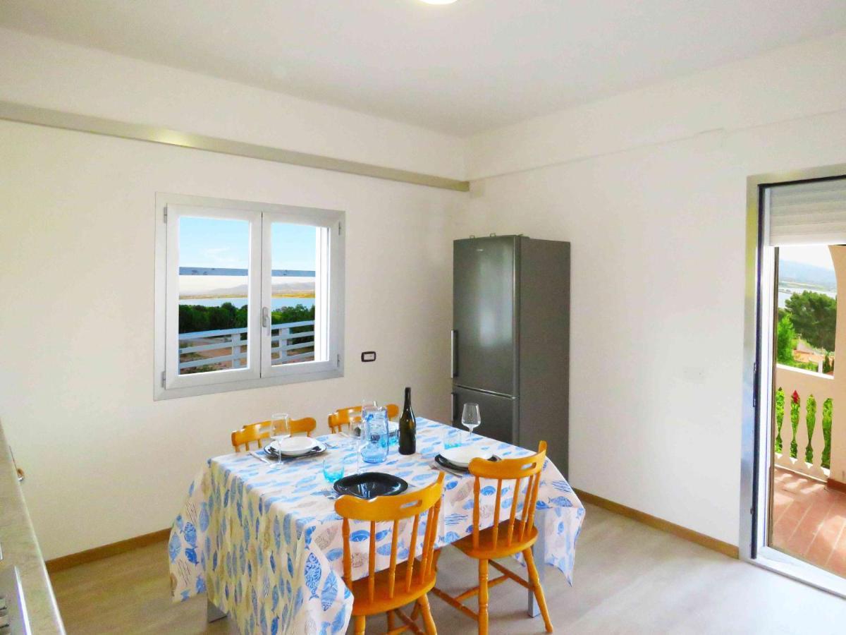 Panohome Porto Pino Bagian luar foto
