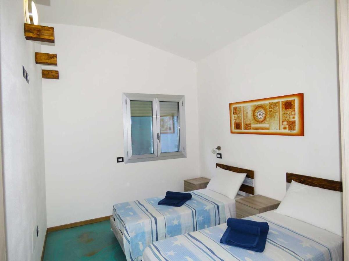 Panohome Porto Pino Bagian luar foto